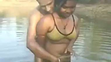 Village couple outdoor bath in pond