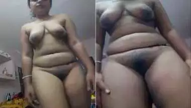 Young Indian woman sets the camera against her showing XXX body