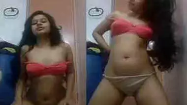 Young Indian woman exposes natural tits and shaved pussy on the camera