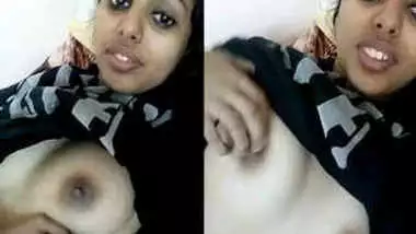 Young Indian woman with big sex eyes flashes her XXX tits in bed