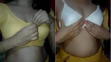 Desi female slowly removes her top and bra exposing XXX boobs on camera