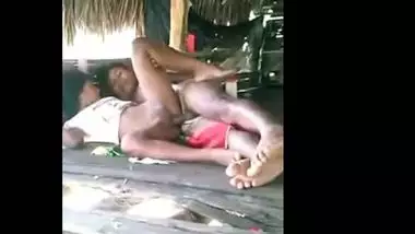 Young couple enjoy outdoor sex in a tent house on the beach