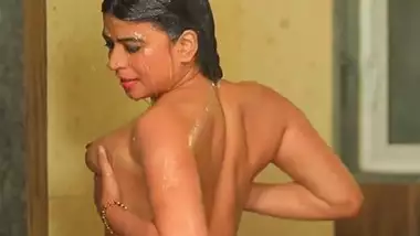 Indian naked Bhabhi takes a shower and presses her boobs